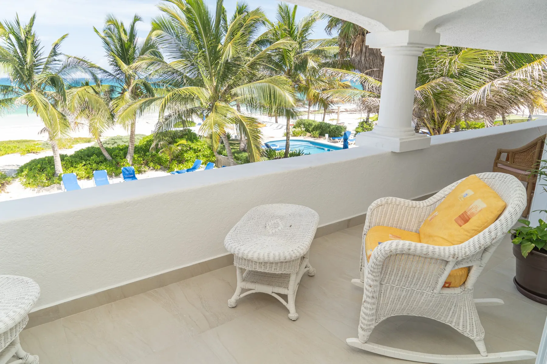 The arched terrace looking over the palms to the sea