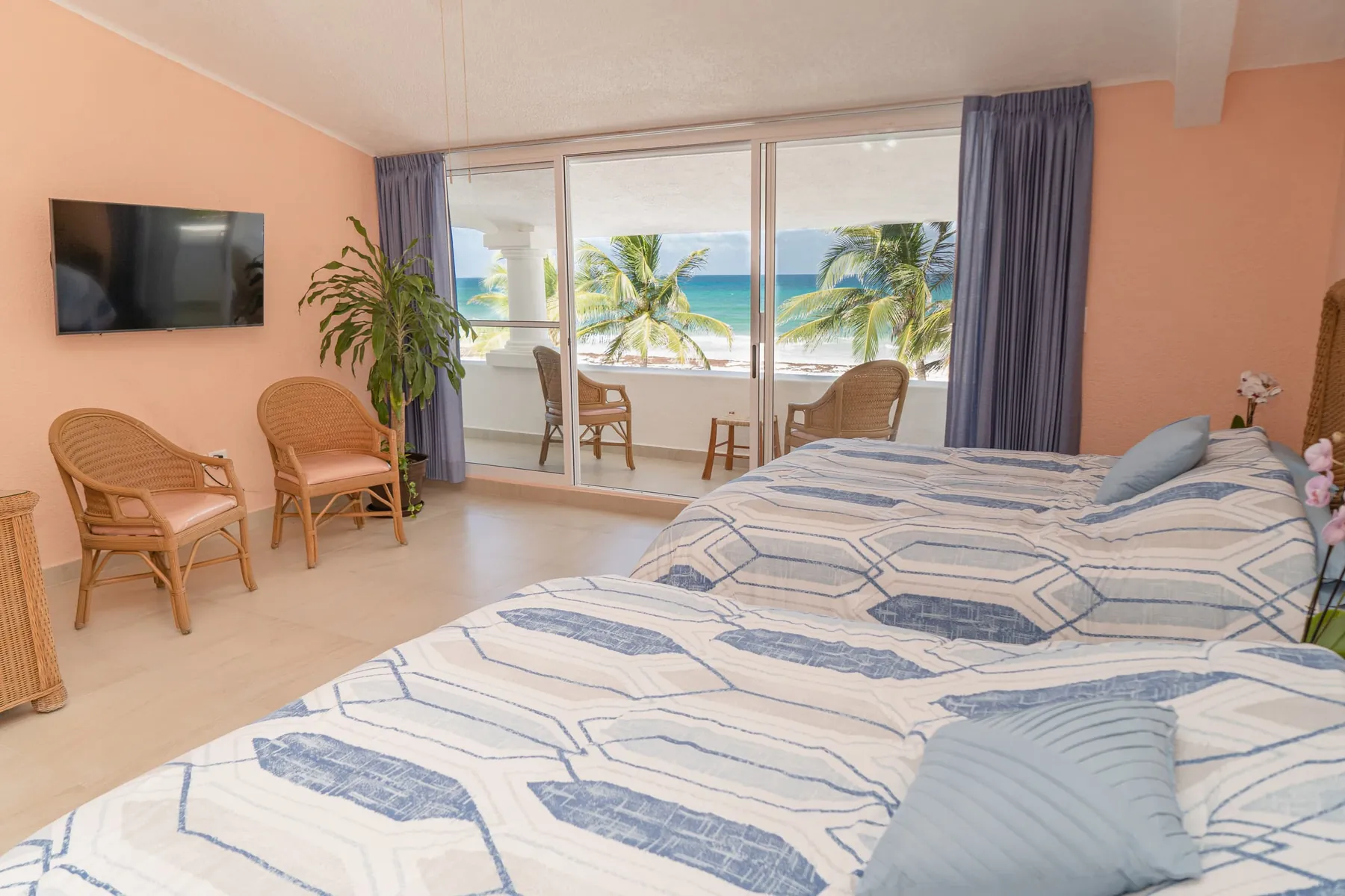 Bedroom 2 with two queen beds facing the sea
