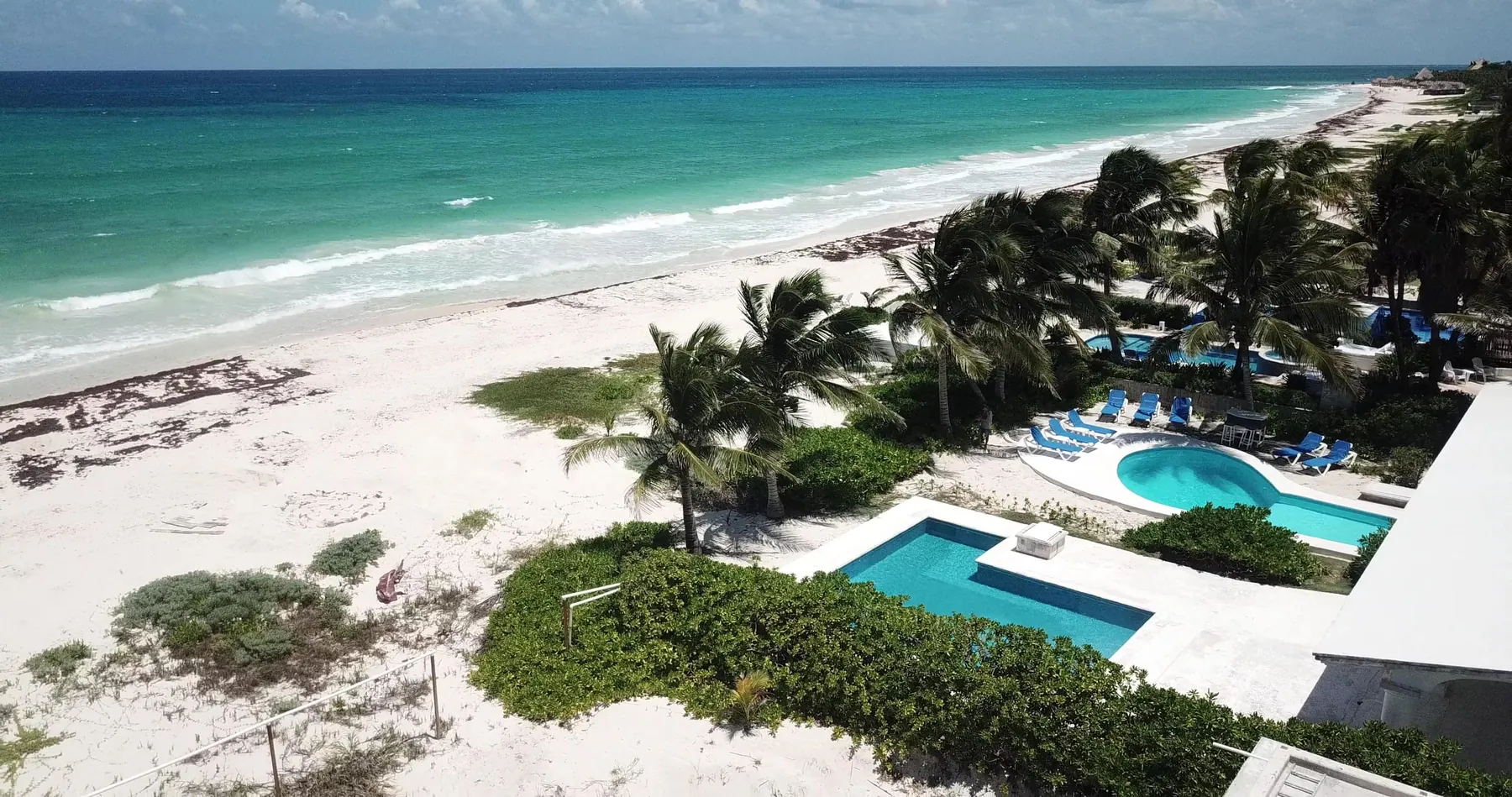 The villa and its beach from the air