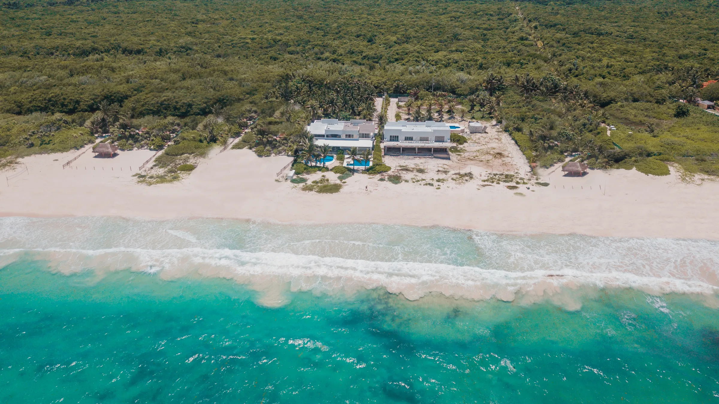 Villa Ixchel and its beach seen from the sea, with the jungle behind